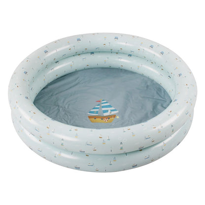 an inflatable swimming pool with a toy boat in it