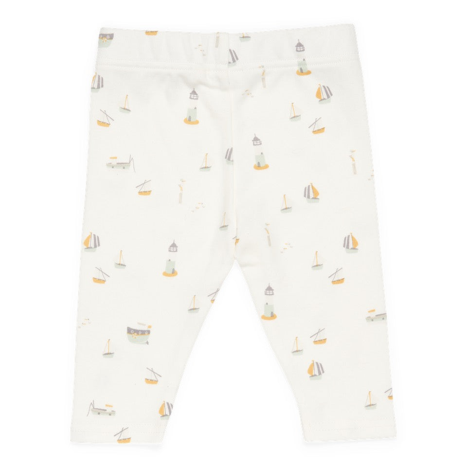 a white legging with sailboats and boats on it