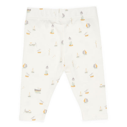 a white legging with sailboats and boats on it