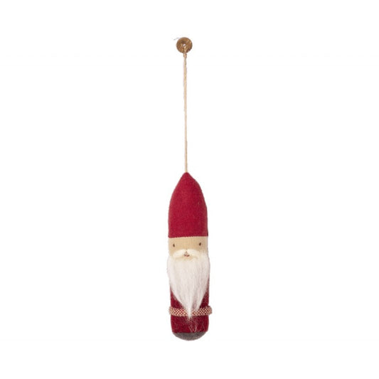 a red and white santa claus ornament hanging from a cord
