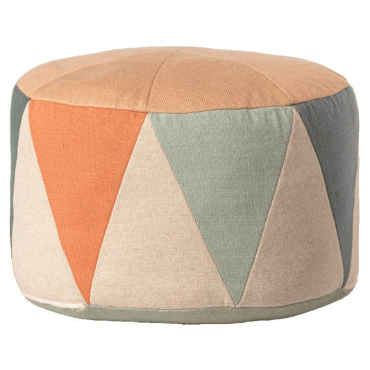 a round ottoman with a multicolored pattern on it
