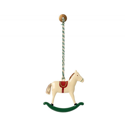 a toy horse hanging from a rope on a white background