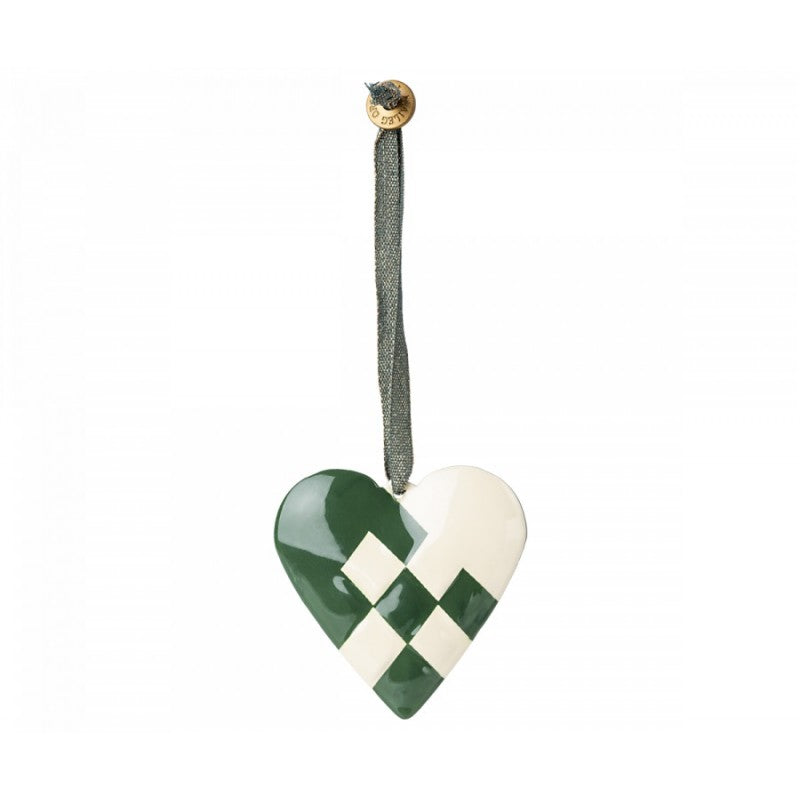 a green and white heart ornament hanging from a string